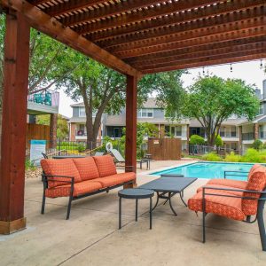 Sitting area by pool at Henry Heights Apartments