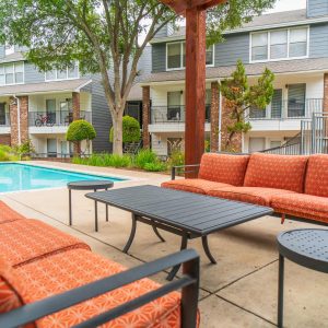 Sitting area by pool at Henry Heights Apartments