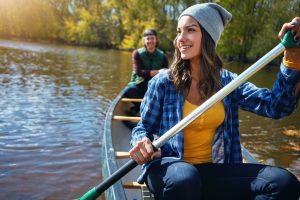Shot of a young couple going for a canoe ride on the lake